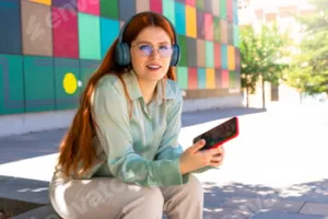 Redhead girl. Visual Symphony: Gorgeous Redhead Girl Harmonizing Technology and Art Outdoors