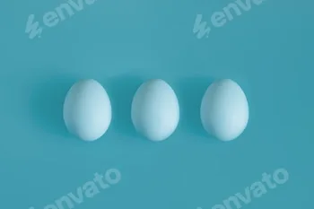 Three White chicken eggs on a blue background in the center.