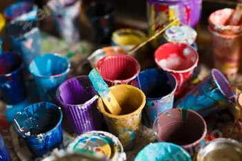 multicolored cans with paint, arts background