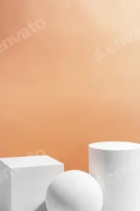 White geometric shapes arranged stylishly on a soft peach background in a minimalist setting