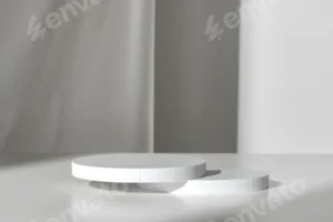 Modern Minimalist White Sculpture Displayed on Soft Draped Fabric in Natural Light