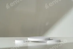 Modern Minimalist White Sculpture Displayed on Soft Draped Fabric in Natural Light