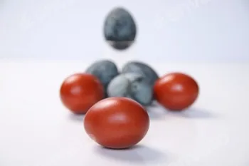 Defocus blue and red eggs on white background. Minimal Easter celebration concept. Design, visual ar