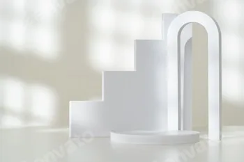 Modern Minimalist White Sculpture Displayed on Soft Draped Fabric in Natural Light