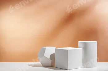 White geometric shapes arranged stylishly on a soft peach background in a minimalist setting