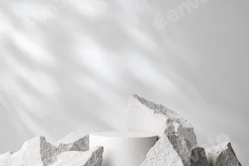 A minimalistic display featuring a smooth white cylinder surrounded by rough gray stone fragments 38 A minimalistic display featuring a smooth white cylinder surrounded by rough gray stone fragments