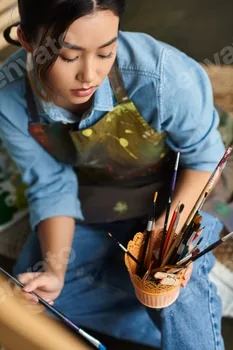 Focused artist in her workshop