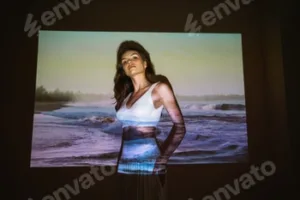 Young adult woman 20 years old with projected image of ocean or see in neon colors