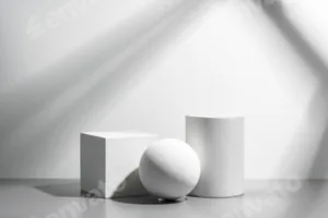 Abstract composition featuring three white geometric shapes in a minimalist interior setting