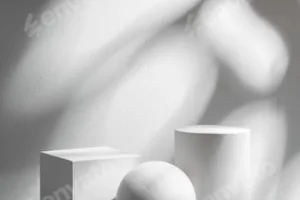 Abstract composition featuring three white geometric shapes in a minimalist interior setting