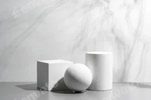 Abstract composition featuring three white geometric shapes in a minimalist interior setting