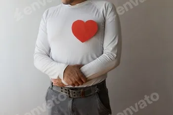 Creative heart art display by a person in a white shirt against a plain background