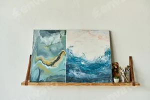 Mature woman creating beautiful ocean-inspired paintings in her art studio