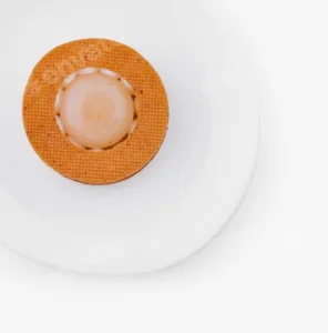 Minimalist orange sphere on textured mat