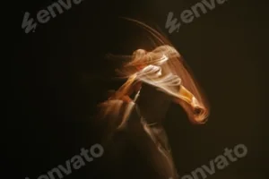 Blurred motion shot of a woman in a white shirt on a black background