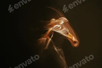 Blurred motion shot of a woman in a white shirt on a black background 2 Blurred motion shot of a woman in a white shirt on a black background