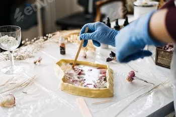 Crafting with resin and dried flowers, using a wooden stick to create detailed art pieces 4 Crafting with resin and dried flowers, using a wooden stick to create detailed art pieces