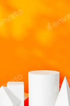 White geometric shapes on a vibrant orange background with soft shadows in a well-lit indoor setting