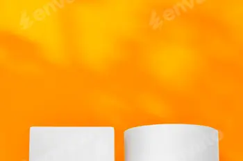 White geometric shapes on a vibrant orange background with soft shadows in a well-lit indoor setting 8 White geometric shapes on a vibrant orange background with soft shadows in a well-lit indoor setting