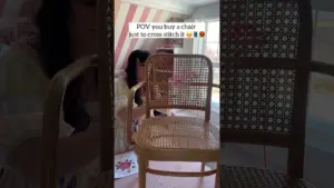 I thrifted this $15 rattan chair & knew immediately I wanted to cross stitch the back! #thriftflip